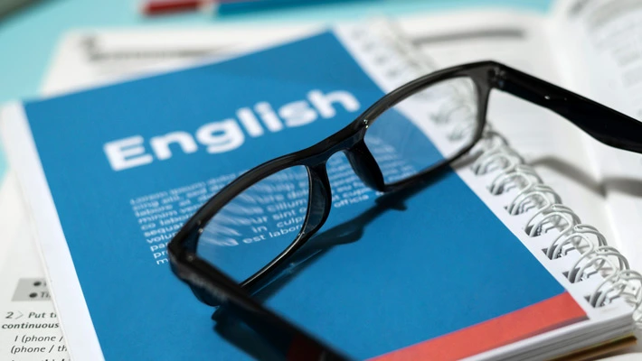 Glasses lying on the books